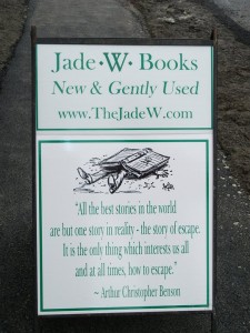 Full colour. This sandwich board actually has four signs, two small (one on each side) with the shop name, and two of a quotation with graphic that changed weekly